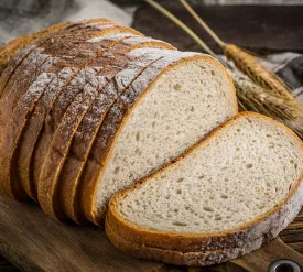 Sliced loaf of bread on a chopping board Aunt Millie's