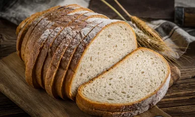 Sliced loaf of bread on a chopping board Aunt Millie's