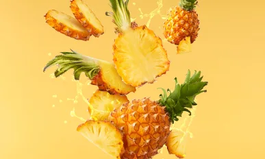 Baby Pineapple with slice flying in air