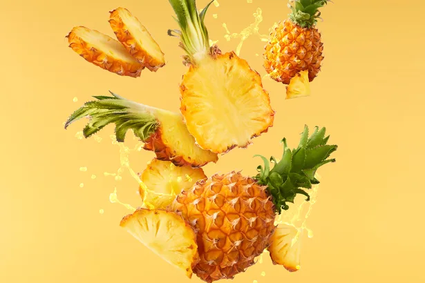 Baby Pineapple with slice flying in air