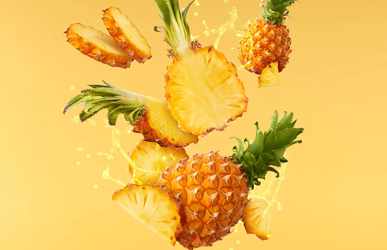 Baby Pineapple with slice flying in air