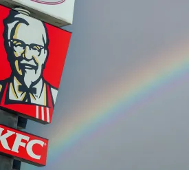 Kentucky Fried Chicken pylon sign over blue sky