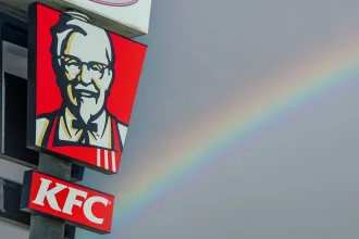 Kentucky Fried Chicken pylon sign over blue sky