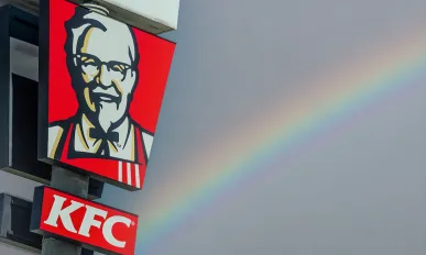 Kentucky Fried Chicken pylon sign over blue sky