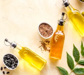 Different kind of cooking oil - sunflower olive and sesame oil with seeds